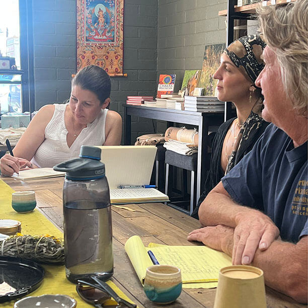 3 people listening and writing